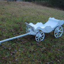 In White, with Amish made heavy duty hickory wheels- banded in steel- an additional cost
